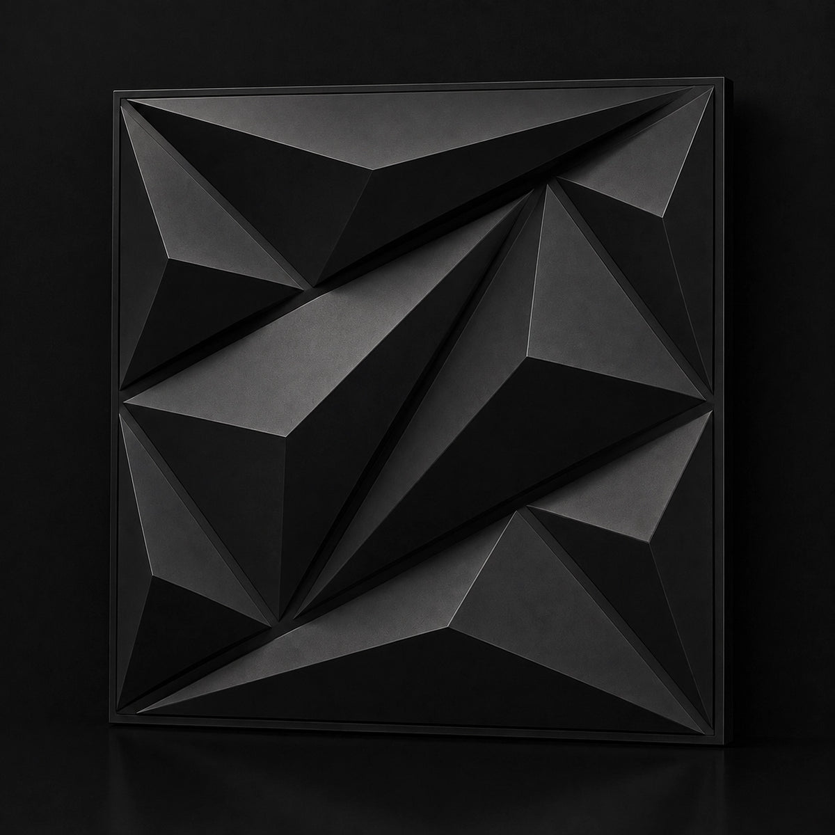 A square black 3D geometric wall art panel with faceted polygonal relief, shown against a dark black background.